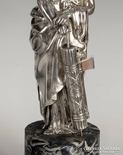 Silver statue of the goddess Artemis on a marble plinth