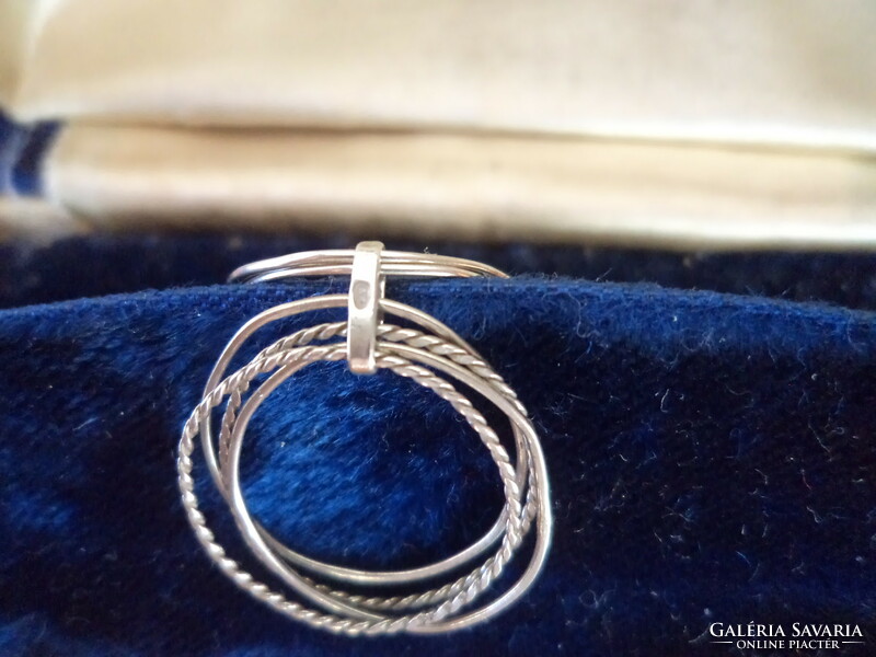 A silver ring consisting of several rings _marked