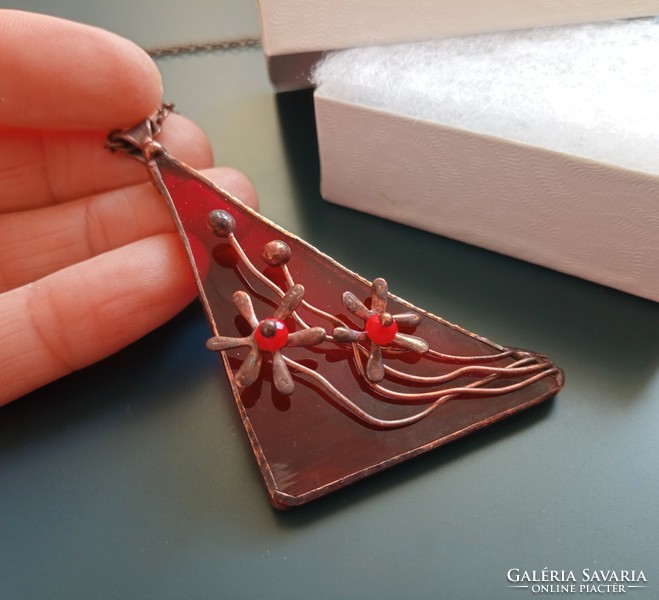 Handmade red glass pendant with small copper flowers