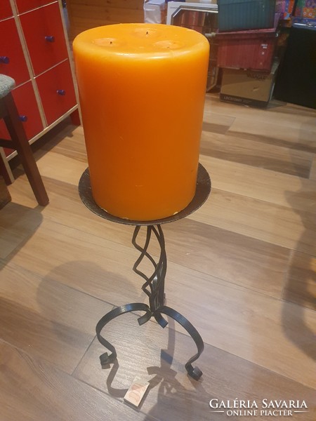 Huge wrought iron candle holder with giant candle