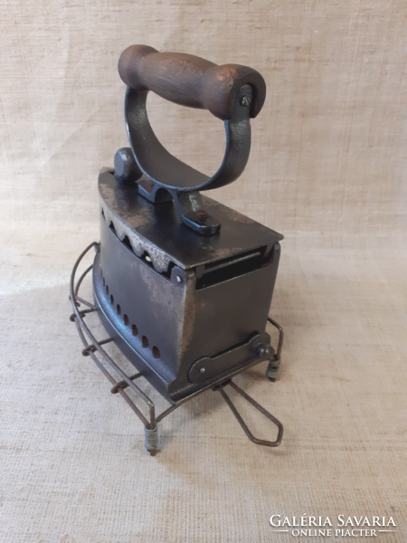 Old cast iron iron with ironing pad