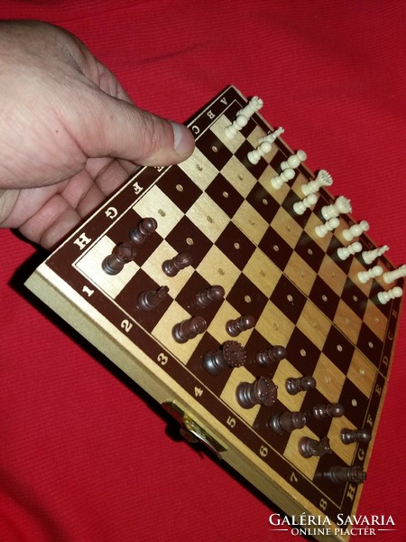 Old traveling chess set with pieces with 