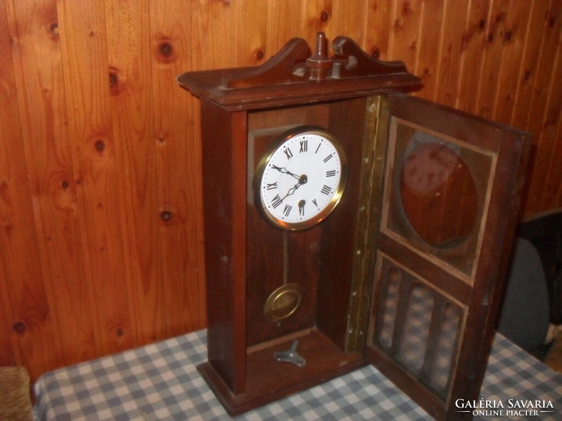 Old pendulum wall clock