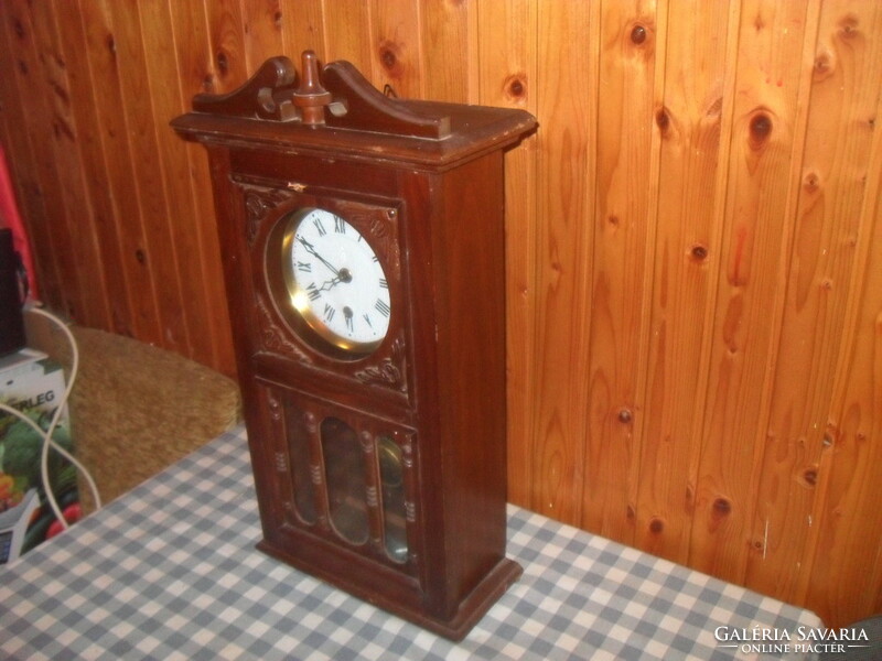 Old pendulum wall clock