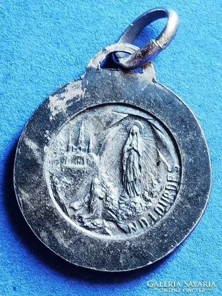 Old silver-plated medal of the Holy Virgin of Lourdes