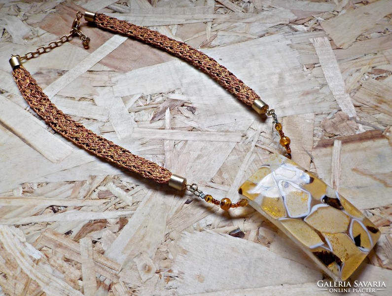 Large yellow glass pendant on a braided yellow and red copper chain
