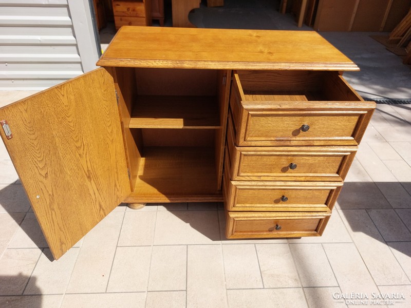 A 4-drawer oak chest of drawers with doors for sale. Furniture is beautiful, in like-new condition.