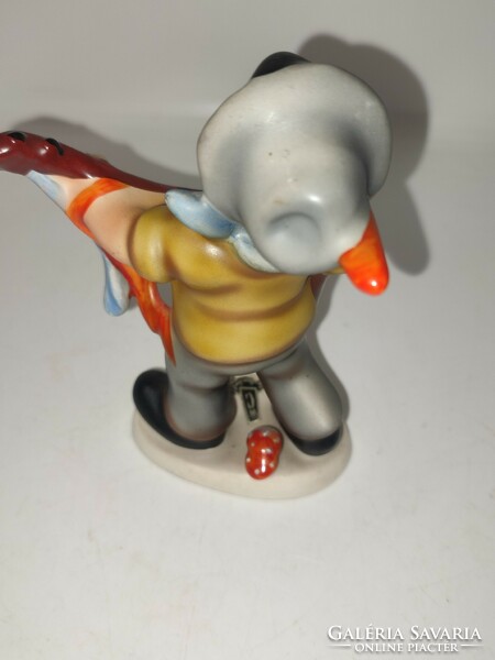 Rare West German cortendorf figure of a boy with a guitar.