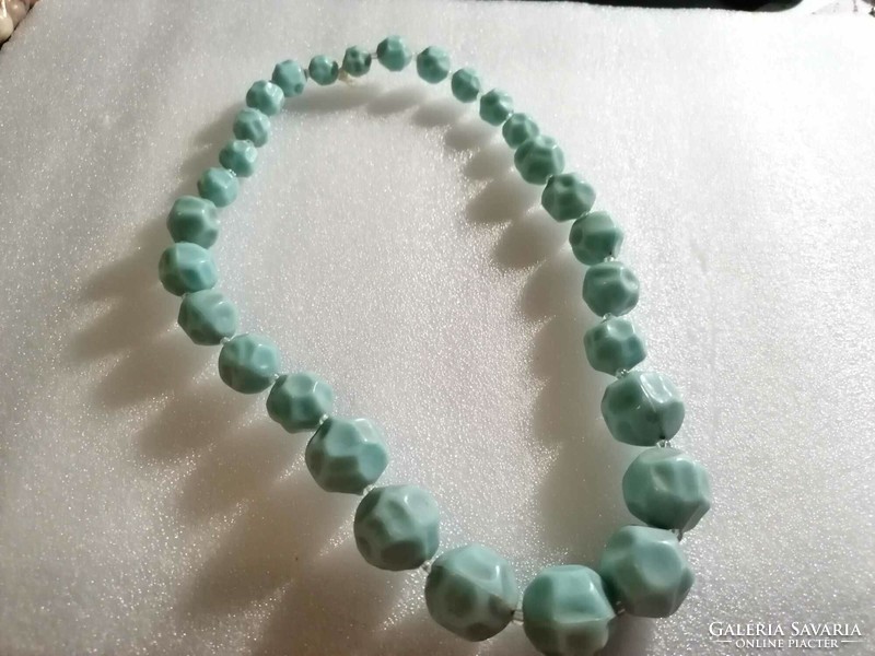 An interesting string of pale mint colored pearls