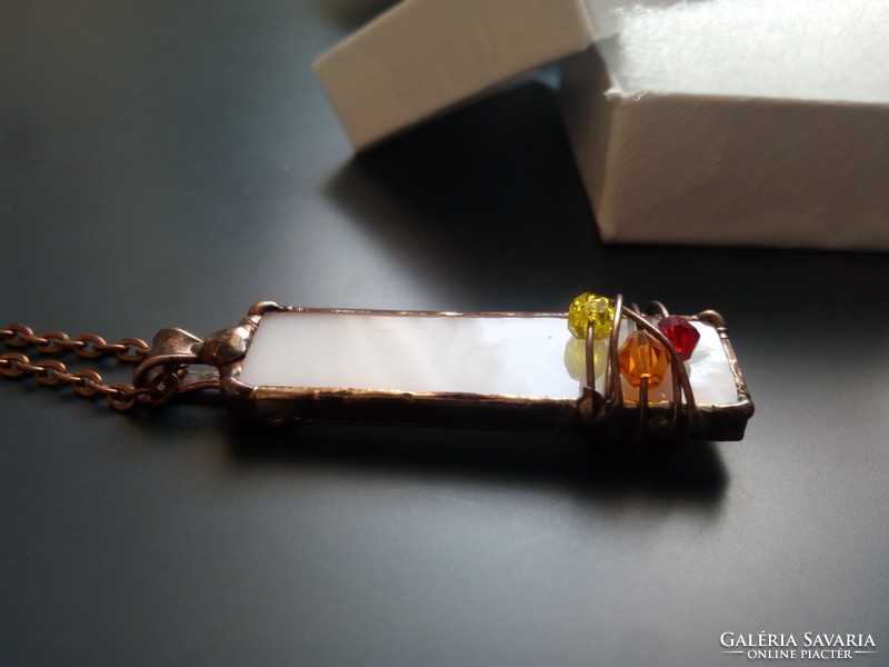 Beautiful glass pendant made of white glass and colorful tiny pearls