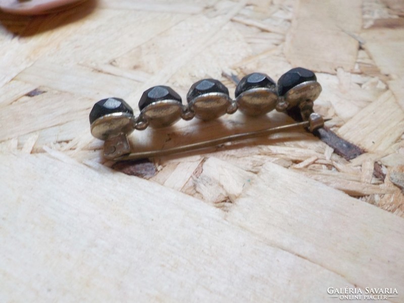 Old black polished stone brooch