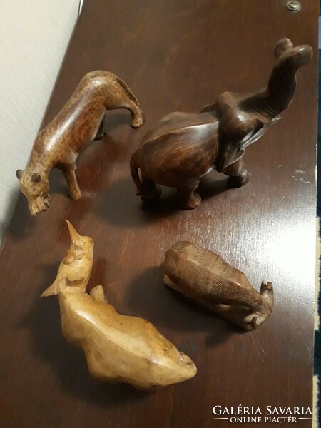 Carved animals, made of wood, from one piece, preferably together, the front horn of the rhinoceros is glued. Sale!