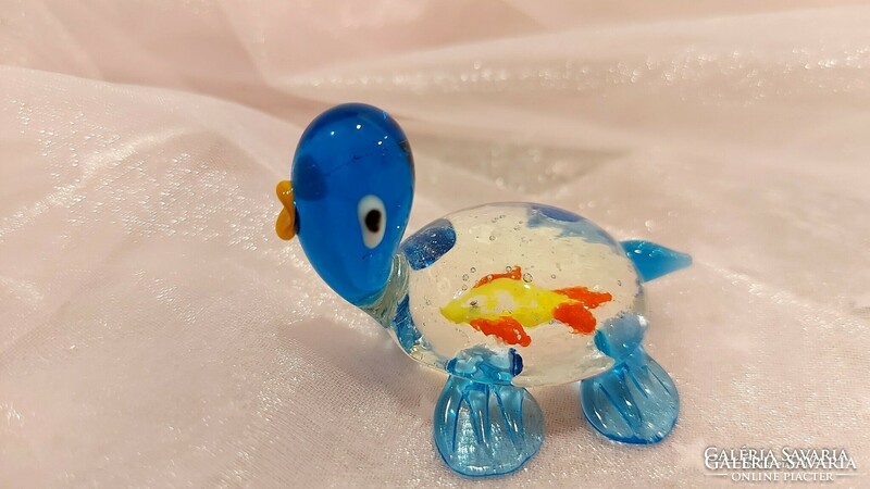 Glass turtle with fish.