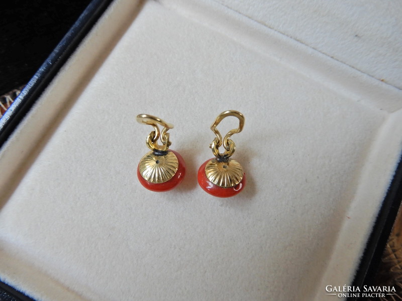 Old gold-plated clip-on earrings with a pair of corals
