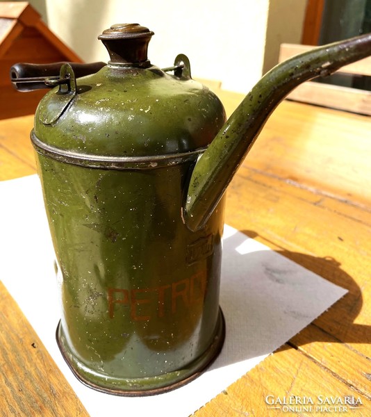 Old petroleum oil can, olive green metal can with copper lid, antique vintage