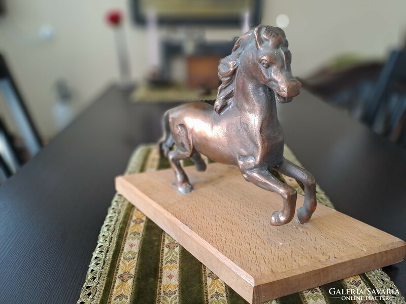 Bronzed horse on pedestal