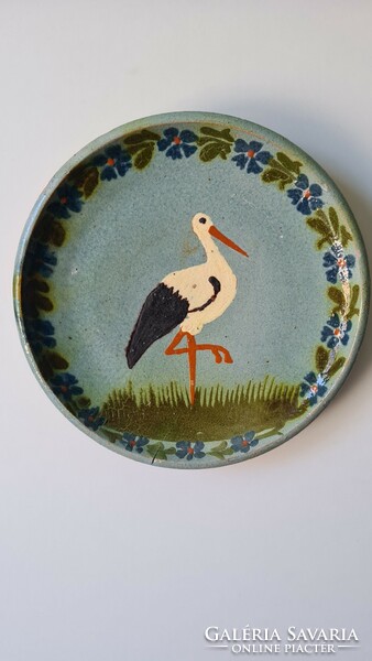 Wall plate with folk stork motif