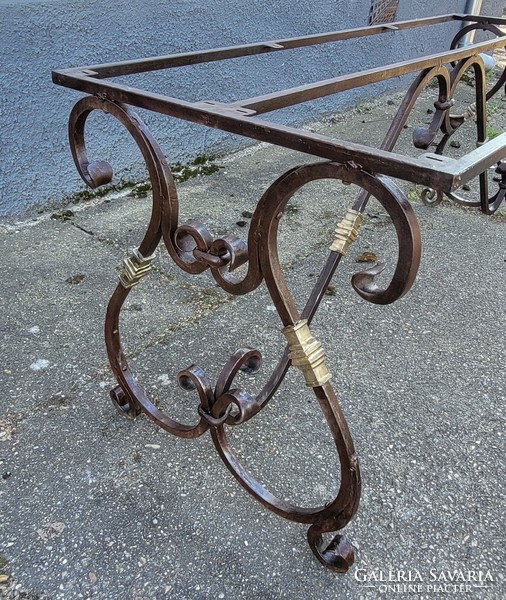 Special, old forged garden table frame with copper elements