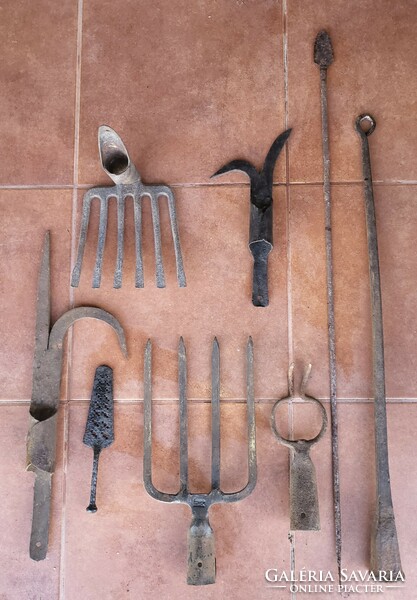 Wrought iron tools, spade fork, pickaxe, scythe anvil, etc.