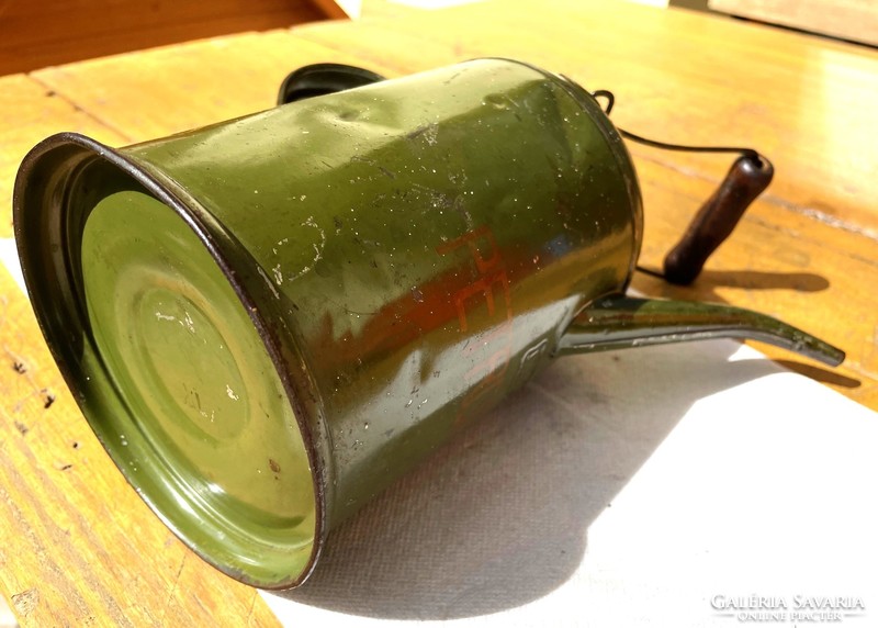 Old petroleum oil can, olive green metal can with copper lid, antique vintage