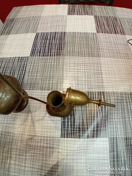 A pair of Indian copper decanters