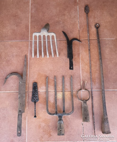Wrought iron tools, spade fork, pickaxe, scythe anvil, etc.