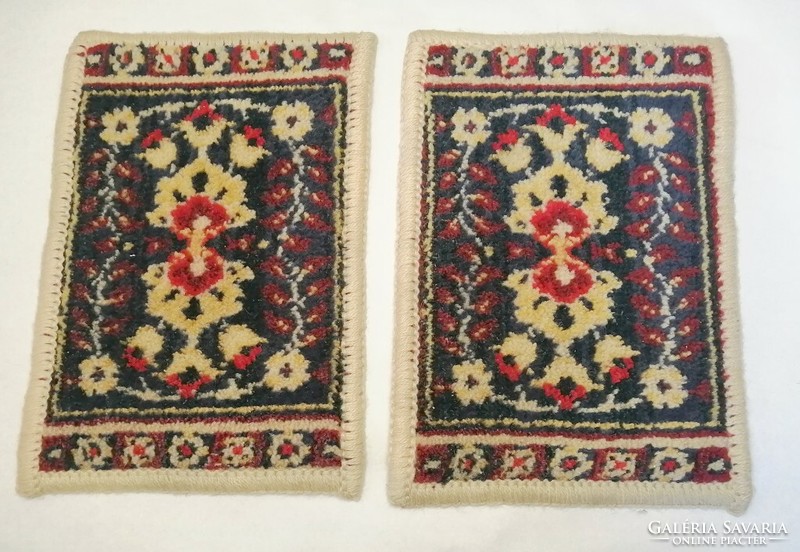 A pair of hand-woven Persian baby rugs with the same pattern