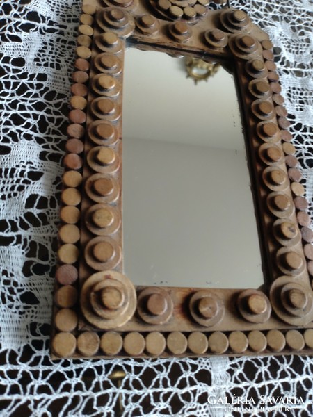 Decorative mirror with leather decoration