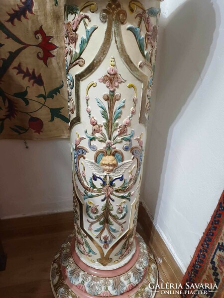 A particularly beautiful and very rare majolica postman. Decorated with angels and flowers. 80cm high