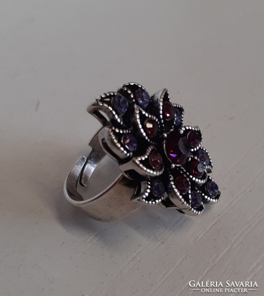 Old silver-plated ring in beautiful condition set with purple polished stones in a patterned setting