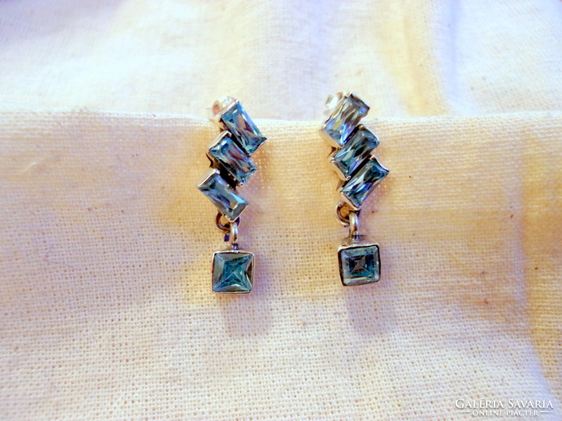 Special silver earrings with blue topaz stone decoration