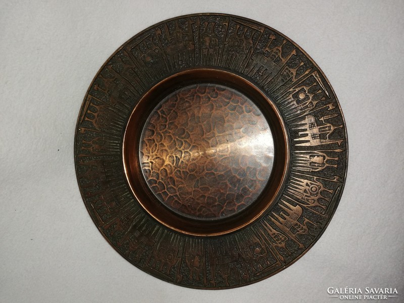 Juried bronze wall plate marked Nb, with relief decoration
