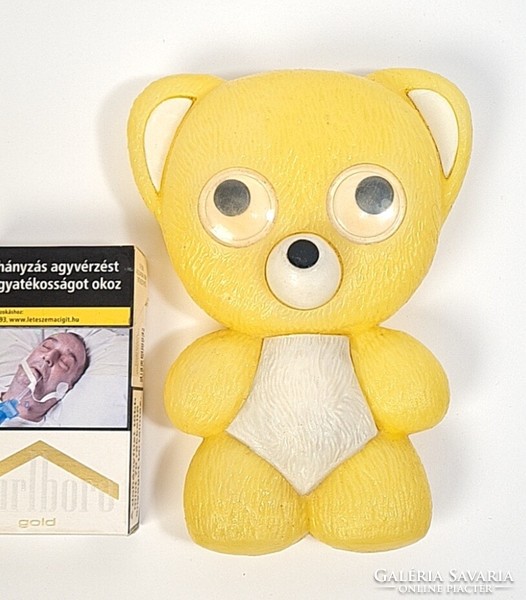 Plastic teddy bear with retro traffic sign and moving eyes