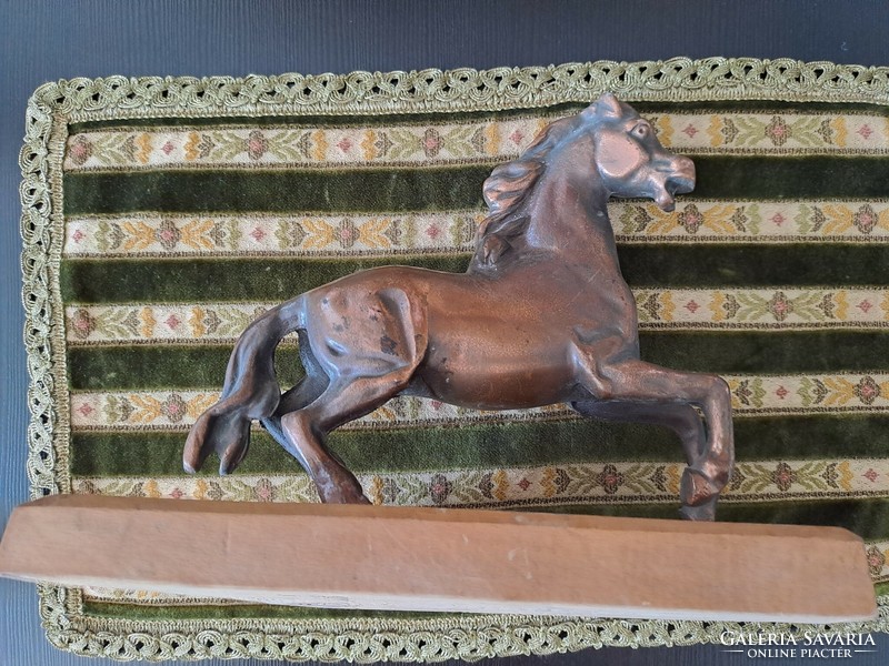 Bronzed horse on pedestal