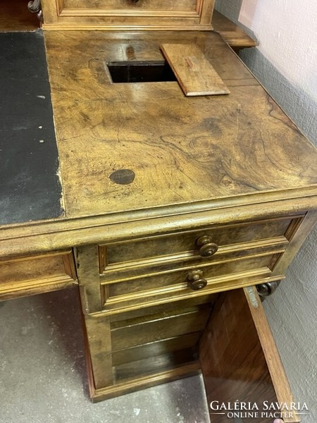 An antique neo-baroque desk is a specialty