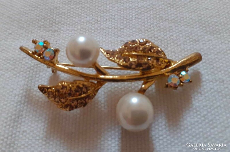 Vintage gold-colored brooch, decorated with thekla and aurora borealis crystal (with stone)