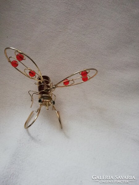 Gold-colored, handmade decorative bee