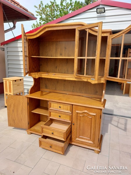 For sale is a large oak display cabinet in good condition. Dimensions: 135 cm wide x 44 cm
