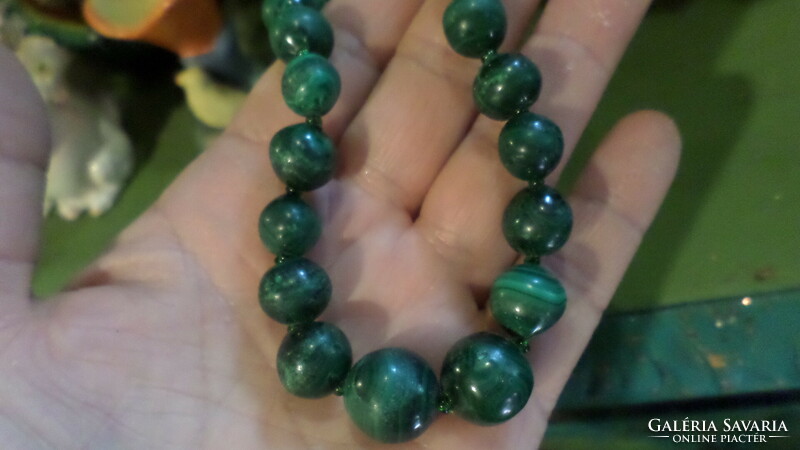 Vintage necklace made of 46 cm malachite beads. The largest eye is about 1.5 cm.