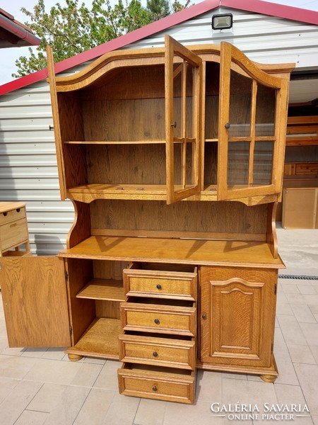 For sale is a large oak display cabinet in good condition. Dimensions: 135 cm wide x 44 cm