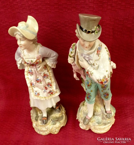Porcelain couple figural sculpture. They are 38 cm high