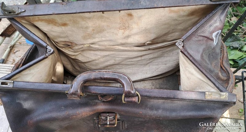 Antique large leather bag. For theater props and decorations.