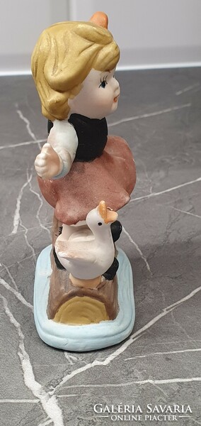 Ceramic figurine of a little girl with a goose