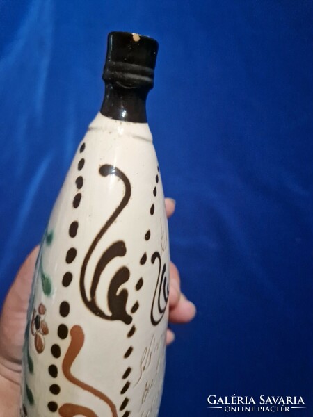 Ceramic bottle with bird pattern inscription
