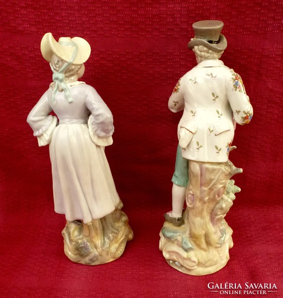 Porcelain couple figural sculpture. They are 38 cm high