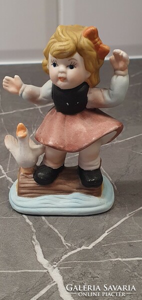 Ceramic figurine of a little girl with a goose