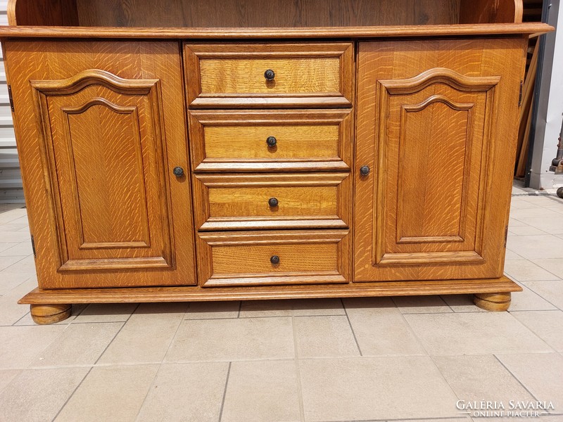 For sale is a large oak display cabinet in good condition. Dimensions: 135 cm wide x 44 cm