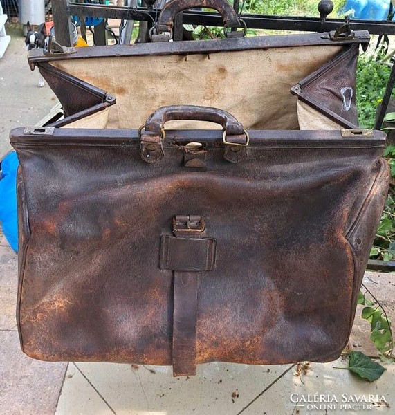 Antique large leather bag. For theater props and decorations.