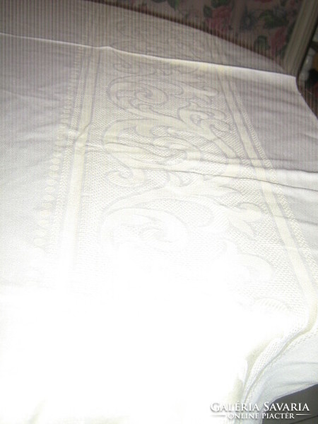 Beautiful yellow damask tablecloth with baroque pattern