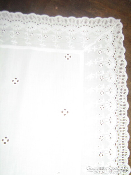 Beautiful filigree snow-white madeira tablecloth with lace edges